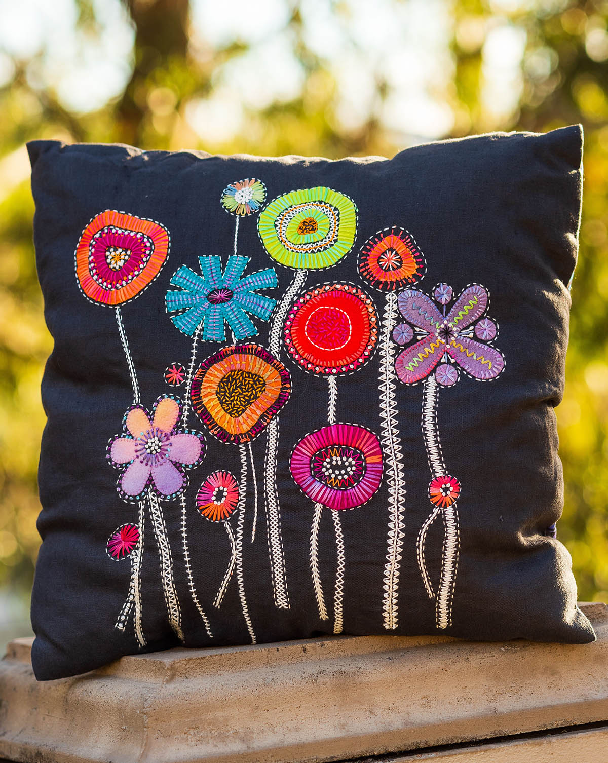 Applique cushion cover mixture of machine applique and hand embroidery flower design in pink and blue